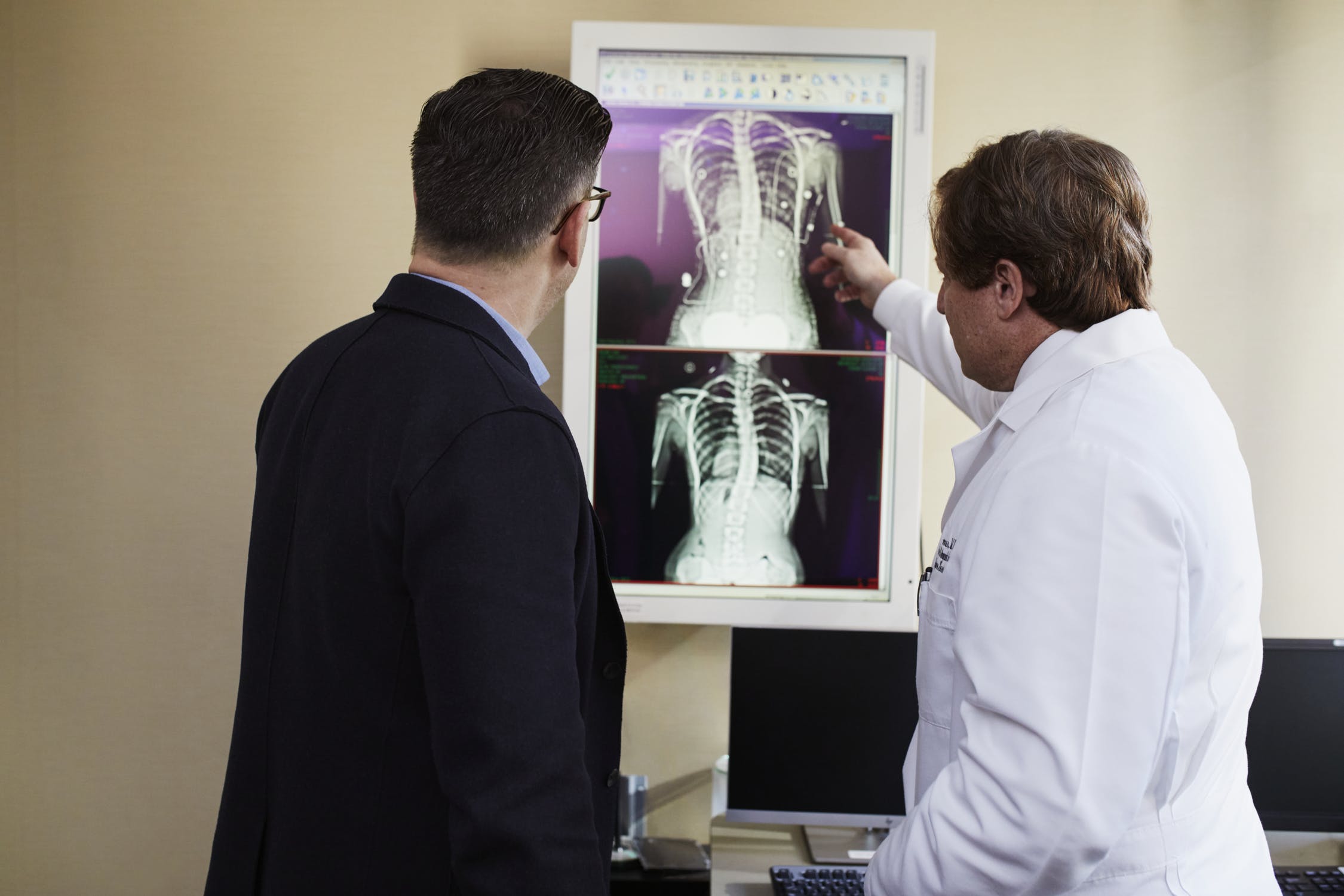 doctor reviewing x-rays with patient